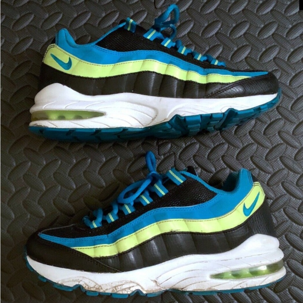 Nike Black and Blue Sneakers with Air Cushion and Sleek Design